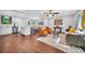 Stylish living room with connecting kitchen, dining area, and hard wood floors at 1893 Burning Tree Dr, Decatur, GA 30032