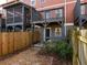 External view of a multi-level back decks and patios in a townhome backyard with a fence at 380 Grant Se Cir # 306, Atlanta, GA 30315