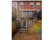 View of backyard patios and decks with exterior of townhome in the background at 380 Grant Se Cir # 306, Atlanta, GA 30315