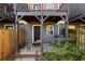 View of the backyard shows a small patio area with access to the unit at 380 Grant Se Cir # 306, Atlanta, GA 30315