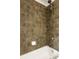 Close up of tiled shower featuring a white tub, a showerhead and shower handle at 380 Grant Se Cir # 306, Atlanta, GA 30315