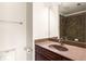 Tiled bathroom featuring vanity with dark wood cabinets and a brown countertop at 380 Grant Se Cir # 306, Atlanta, GA 30315