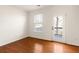 This bedroom offers wood floors, a large window and convenient access to a personal outdoor deck at 380 Grant Se Cir # 306, Atlanta, GA 30315