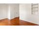 Bright bedroom features hardwood floors and a built-in shelving unit, offering plenty of storage at 380 Grant Se Cir # 306, Atlanta, GA 30315