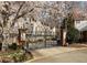 Community entrance with brick pillars, wrought iron gate and landscaping at 380 Grant Se Cir # 306, Atlanta, GA 30315