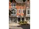 Charming townhouse exterior showcasing a tidy yard, muted colors, and convenient garage access to each home at 380 Grant Se Cir # 306, Atlanta, GA 30315