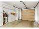 Garage with epoxy flooring, storage shelving, and water heater at 380 Grant Se Cir # 306, Atlanta, GA 30315
