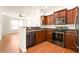 Well-equipped kitchen featuring stainless steel appliances, wood cabinets, and an open layout for cooking at 380 Grant Se Cir # 306, Atlanta, GA 30315