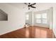 Inviting living room with a modern ceiling fan, white walls, wood flooring, and ample natural light at 380 Grant Se Cir # 306, Atlanta, GA 30315