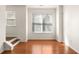 Bright living room with gleaming wood floors, large windows, and stairs to upper level for easy access at 380 Grant Se Cir # 306, Atlanta, GA 30315
