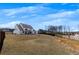 Expansive backyard featuring a pond and modern home with patio at 4732 Cooling Water Cir, Powder Springs, GA 30127