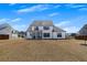 Large backyard with a modern home and extended patio at 4732 Cooling Water Cir, Powder Springs, GA 30127