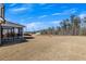 Backyard showcasing a spacious yard with patio and a sunroom at 4732 Cooling Water Cir, Powder Springs, GA 30127