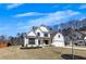 Charming two-story home with a light brick facade, covered entryway, and attached two-car garage, surrounded by a green lawn at 4732 Cooling Water Cir, Powder Springs, GA 30127