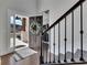 Bright foyer showcasing hardwood floors, an open entryway, and an elegant staircase, creating a warm and inviting atmosphere at 4732 Cooling Water Cir, Powder Springs, GA 30127