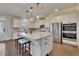 Bright kitchen featuring an island with breakfast bar, stainless appliances and lots of cabinet space at 4732 Cooling Water Cir, Powder Springs, GA 30127