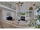 Bright living room with fireplace, built-ins, sectional sofa and grand piano at 4732 Cooling Water Cir, Powder Springs, GA 30127