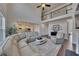 Open concept living room with fireplace, sectional sofa, and view to the kitchen at 4732 Cooling Water Cir, Powder Springs, GA 30127