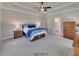 Inviting main bedroom with a tray ceiling, neutral color palette, and lots of natural light at 4732 Cooling Water Cir, Powder Springs, GA 30127