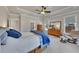 Spacious main bedroom featuring a tray ceiling, windows, and comfortable seating at 4732 Cooling Water Cir, Powder Springs, GA 30127