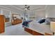 Beautiful main bedroom with tray ceiling, large windows, and wooden furniture at 4732 Cooling Water Cir, Powder Springs, GA 30127
