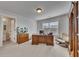 Large home office space featuring a wooden desk, leather chair, and a view into an ensuite bathroom at 4732 Cooling Water Cir, Powder Springs, GA 30127