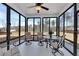 Enclosed sunroom with multiple chairs and table for enjoying outdoor views at 4732 Cooling Water Cir, Powder Springs, GA 30127