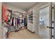 Spacious walk-in closet with custom shelving and organization system, providing ample storage for clothing and accessories at 4732 Cooling Water Cir, Powder Springs, GA 30127