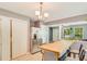 Kitchen with bar seating, stainless steel refrigerator, and white shaker cabinets at 6675 Overton Cir, Cumming, GA 30041