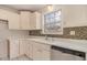 Cozy kitchen featuring white cabinets, mosaic tile backsplash, and modern appliances at 109 Melrose Creek Dr, Stockbridge, GA 30281