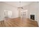 Inviting living room featuring a fireplace, ceiling fan and open layout at 109 Melrose Creek Dr, Stockbridge, GA 30281