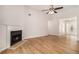 Spacious living room with a cozy fireplace and wood floors at 109 Melrose Creek Dr, Stockbridge, GA 30281