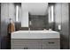 A well lit bathroom with an elegant vanity, contemporary faucet, and decorative tiling at 1101 Juniper Ne St # 519, Atlanta, GA 30309