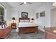 Bedroom features a wood bed frame with a ceiling fan and neutral decor at 1101 Juniper Ne St # 519, Atlanta, GA 30309