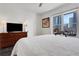 Bedroom boasts ample natural light and modern comfort, with a view of city buildings at 1101 Juniper Ne St # 519, Atlanta, GA 30309