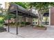 Elegant building entrance with covered walkway, lush landscaping, and inviting access at 1101 Juniper Ne St # 519, Atlanta, GA 30309