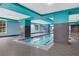 Indoor pool with bright teal accents, tile flooring, and natural light at 1101 Juniper Ne St # 519, Atlanta, GA 30309