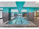 Indoor pool with bright teal accents, tile flooring, and natural light at 1101 Juniper Ne St # 519, Atlanta, GA 30309