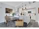 Spacious kitchen featuring a breakfast table, white cabinetry, and stainless steel appliances at 1101 Juniper Ne St # 519, Atlanta, GA 30309