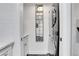 Laundry room featuring a stacked washer and dryer, storage cabinets, and modern decor at 1101 Juniper Ne St # 519, Atlanta, GA 30309