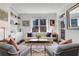Cozy living room with comfortable seating, built-in shelving, and a large window with city views at 1101 Juniper Ne St # 519, Atlanta, GA 30309