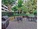 Outdoor grill and seating area with brick pavers and lush landscaping at 1101 Juniper Ne St # 519, Atlanta, GA 30309