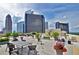 Spacious rooftop deck featuring comfortable seating and stunning city views at 1101 Juniper Ne St # 519, Atlanta, GA 30309