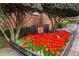 Well-maintained condominium entrance with manicured flower beds and prominent signage at 1101 Juniper Ne St # 519, Atlanta, GA 30309