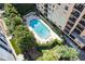 Aerial view of the outdoor pool with lounge chairs and landscaping at 1101 Juniper Ne St # 519, Atlanta, GA 30309