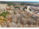 Aerial view of a community bordering an extensive forest at 2536 Kachina Trl, Dacula, GA 30019