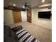 Finished basement with a sliding barn door, ceiling fan, recessed lights, and media center at 2536 Kachina Trl, Dacula, GA 30019