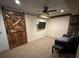 Basement with barn door, media center, recessed lighting and ceiling fan at 2536 Kachina Trl, Dacula, GA 30019