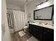 Full bathroom with shower and tub featuring modern fixtures and stylish vanity at 2536 Kachina Trl, Dacula, GA 30019