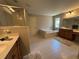 Bright bathroom features a glass enclosed shower and soaking tub beneath a window providing natural light at 2536 Kachina Trl, Dacula, GA 30019